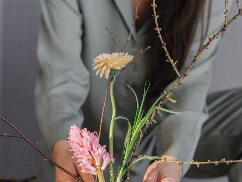 A serene woman practicing yoga in a room with natural light.